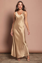 Model Madeline wearing size 10 of the Loulou Satin Slip Dress in colour Latte, from the front, showing the whole outfit