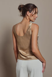 Model Madeline wearing size 10 of the Celeste Satin Camisole in colour Latte, from the back