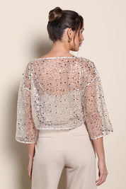 Model Maddiec wearing size 10 of the Petite Nina Sequin Top – Gold in colour Gold, from the back