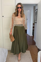 Model Genericm wearing size sample of the Petite Nina Sequin Top – Gold in colour Gold, from the front