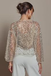 Model Madeline wearing size S of the Nina Sequin Top in colour Gold (Metallics), from the back