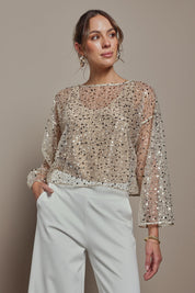 Model Madeline wearing size S of the Nina Sequin Top in colour Gold (Metallics), from the front, cropped image