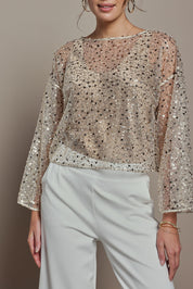 Model Madeline wearing size S of the Nina Sequin Top in colour Gold (Metallics), from the front, cropped image