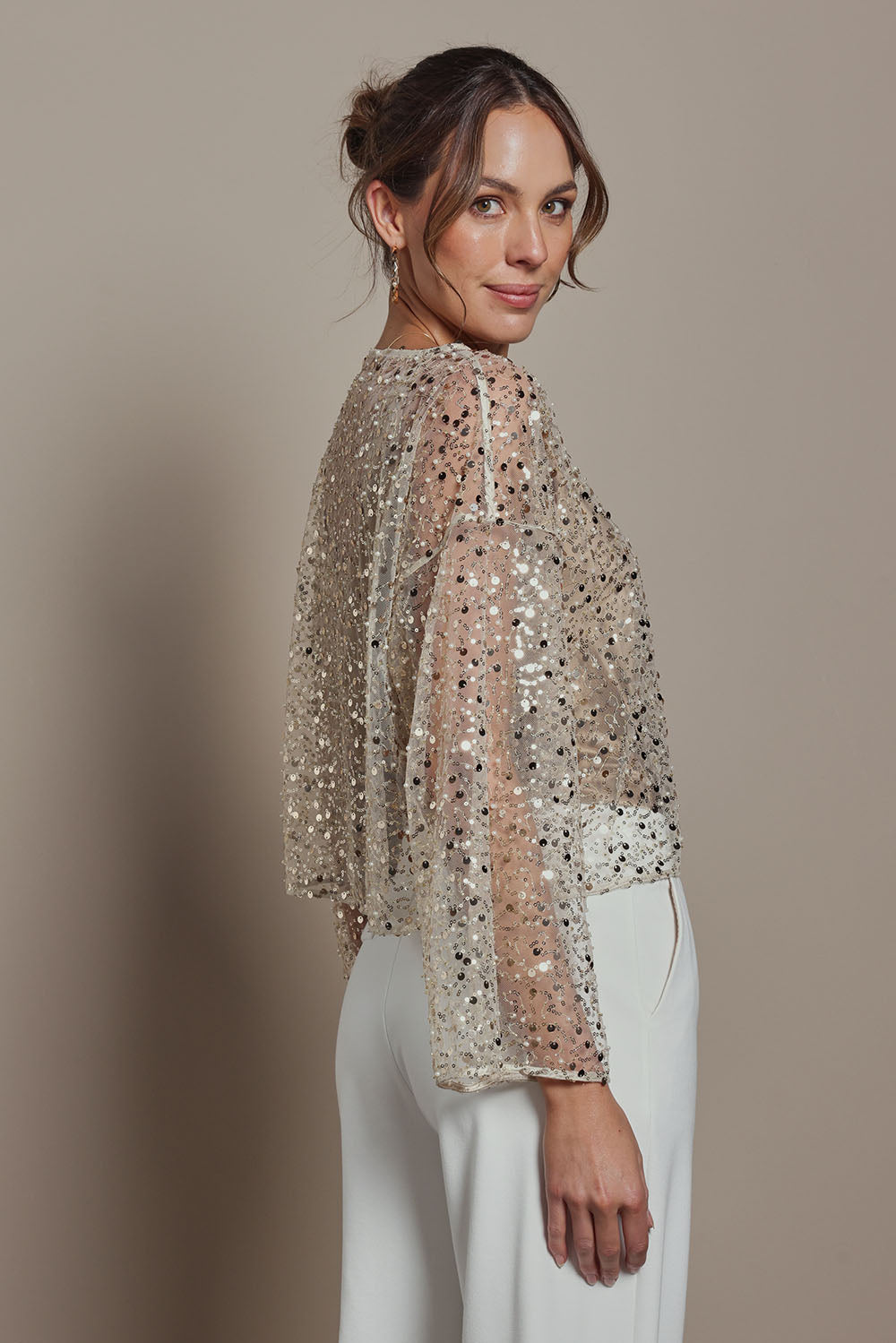 Model Madeline wearing size S of the Nina Sequin Top in colour Gold (Metallics), from the front, cropped image