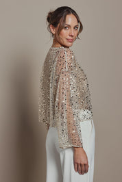 Model Madeline wearing size S of the Nina Sequin Top in colour Gold (Metallics), from the front, cropped image