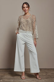 Model Madeline wearing size S of the Nina Sequin Top in colour Gold (Metallics), from the front, showing the whole outfit