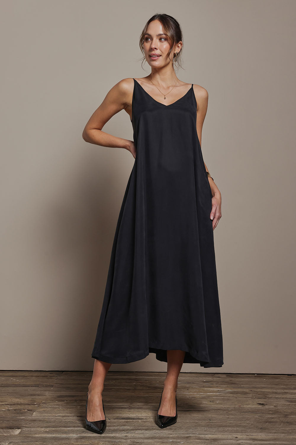 Model Madeline wearing size 10 of the Edith Dress in colour Black (Black), from the front, showing the whole outfit
