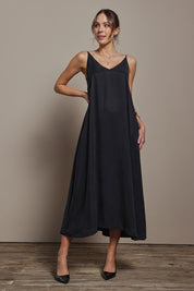 Model Madeline wearing size 10 of the Edith Dress in colour Black (Black), from the front, showing the whole outfit