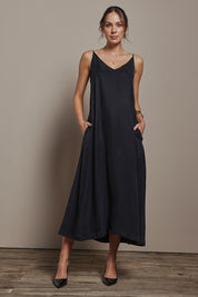 Model Madeline wearing size 10 of the Edith Dress in colour Black (Black), from the front, showing the whole outfit