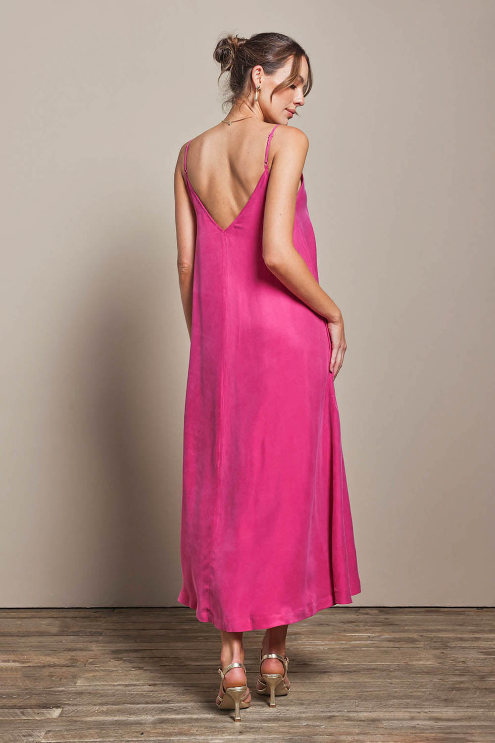 Model Madelinec wearing size 10 of the Edith Dress - Magenta in colour Magenta, from the front