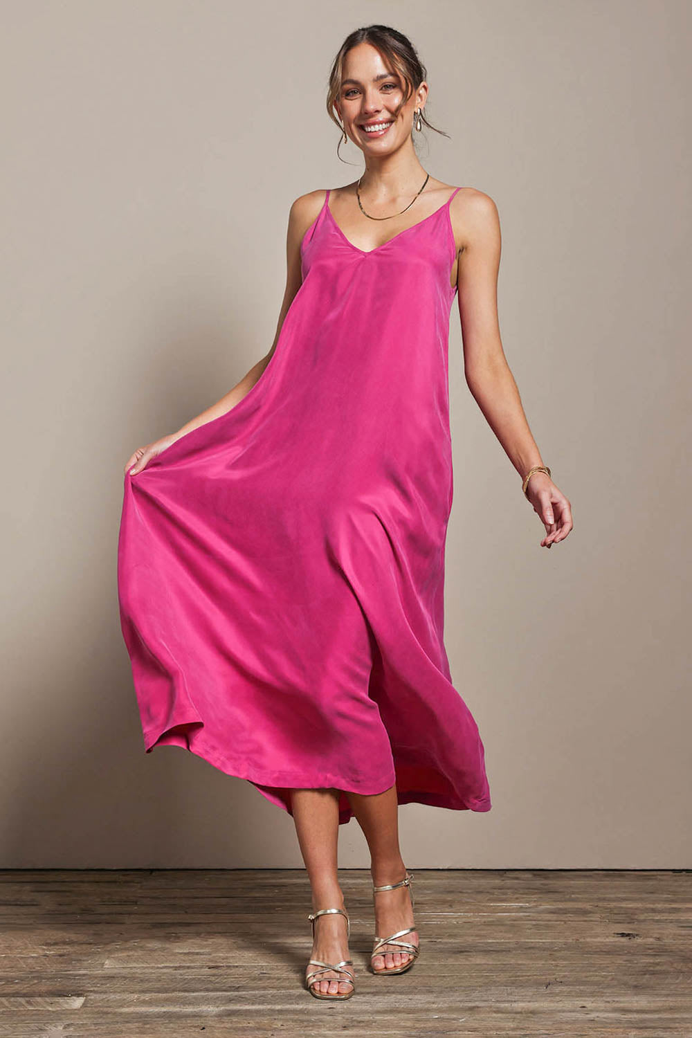 Model Madelinec wearing size 10 of the Edith Dress - Magenta in colour Magenta, from the front