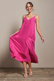 Model Madelinec wearing size 10 of the Edith Dress - Magenta in colour Magenta, from the front