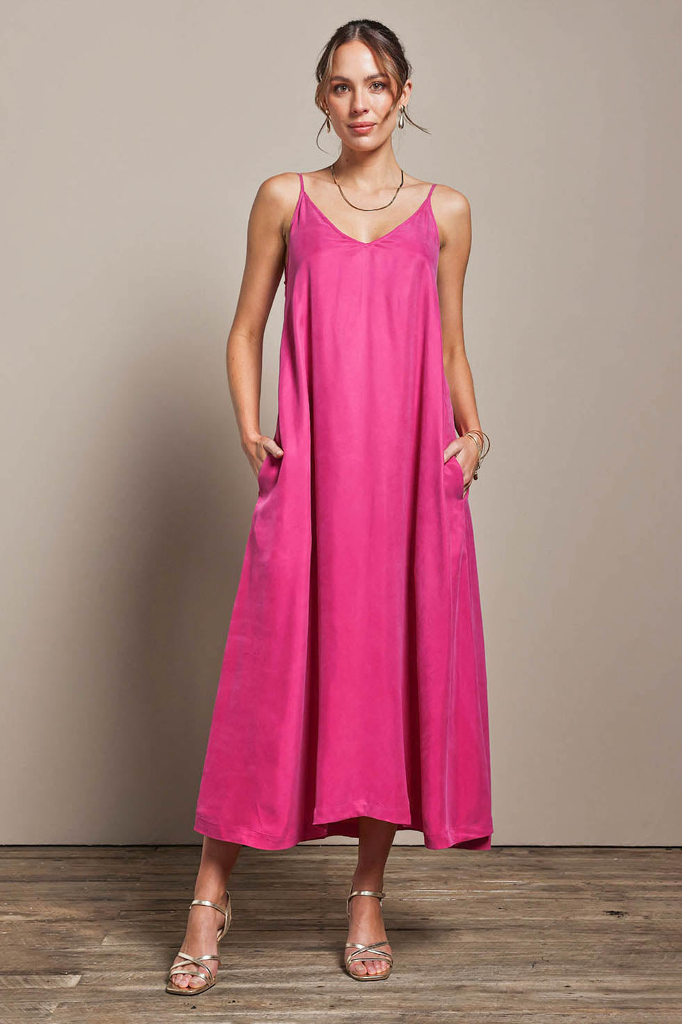 Model Madelinec wearing size 10 of the Edith Dress - Magenta in colour Magenta, from the front
