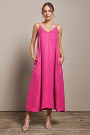 Model Madelinec wearing size 10 of the Edith Dress - Magenta in colour Magenta, from the front