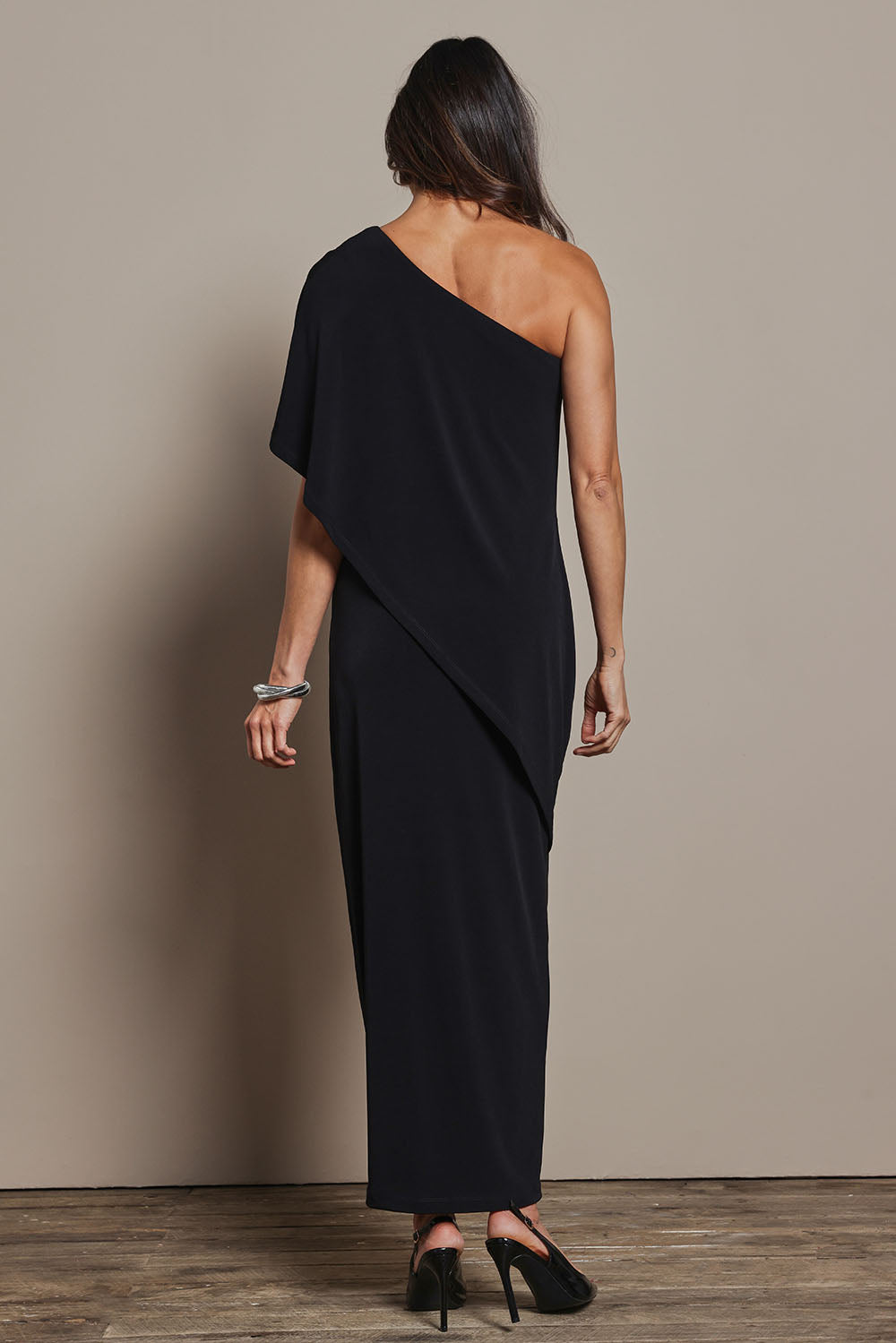 Model Amanda wearing size 10 of the Vanessa Evening Gown in colour Black (Black), from the back