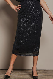 Model Amanda wearing size 10 of the Reegan Sequin Skirt in colour Black (Metallics), from the front, cropped image