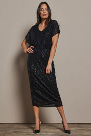 Model Amanda wearing size 10 of the Reegan Sequin Skirt in colour Black (Metallics), from the front, showing the whole outfit