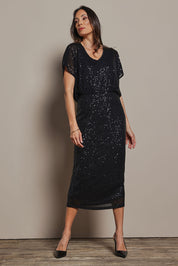 Model Amanda wearing size 10 of the Reegan Sequin Skirt in colour Black (Metallics), from the front, showing the whole outfit