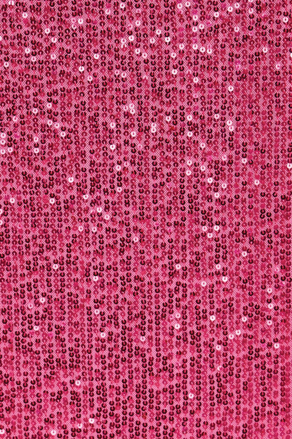 Product shot of the Reegan Sequin Skirt – Cerise in colour Cerise, showing detail