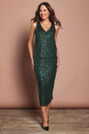 Model Madeline wearing size 10 of the Reegan Sequin Skirt in colour Forest (Metallics), from the front, showing the whole outfit
