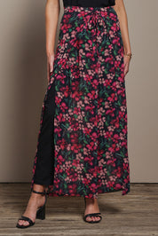 Model Madeline wearing size 10 of the Annette Pants in colour Blossom (Black), from the front, cropped image