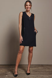 Model Madeline wearing size 10 of the Meave Tuxedo Dress in colour Black (Black), from the front, showing the whole outfit