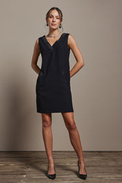 Model Madeline wearing size 10 of the Meave Tuxedo Dress in colour Black (Black), from the front, showing the whole outfit