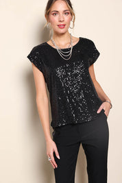 Model Maddiec wearing size 10 of the Reegan Sequin Top – Black in colour Black, in a cropped view