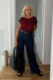 Model Sandy wearing size 10 of the Reegan Sequin Top in colour Rouge (Metallics), from the front, showing the whole outfit