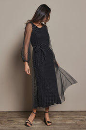 Model Amanda wearing size 10 of the Lorraine Dress in colour Whitedot (Black), from the front, showing the whole outfit