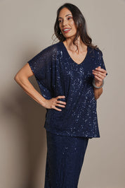 Model Amanda wearing size 10 of the Renee Sequin Top in colour Navy (Metallics), from the front, cropped image