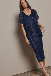 Model Amanda wearing the Renee Sequin Top in colour Navy (Metallics), from the front, showing the whole outfit