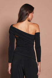 Model Madeline wearing size 10 of the Lucy Top in colour Black (Black), from the back