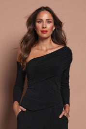 Model Madeline wearing size 10 of the Lucy Top in colour Black (Black), from the front, cropped image