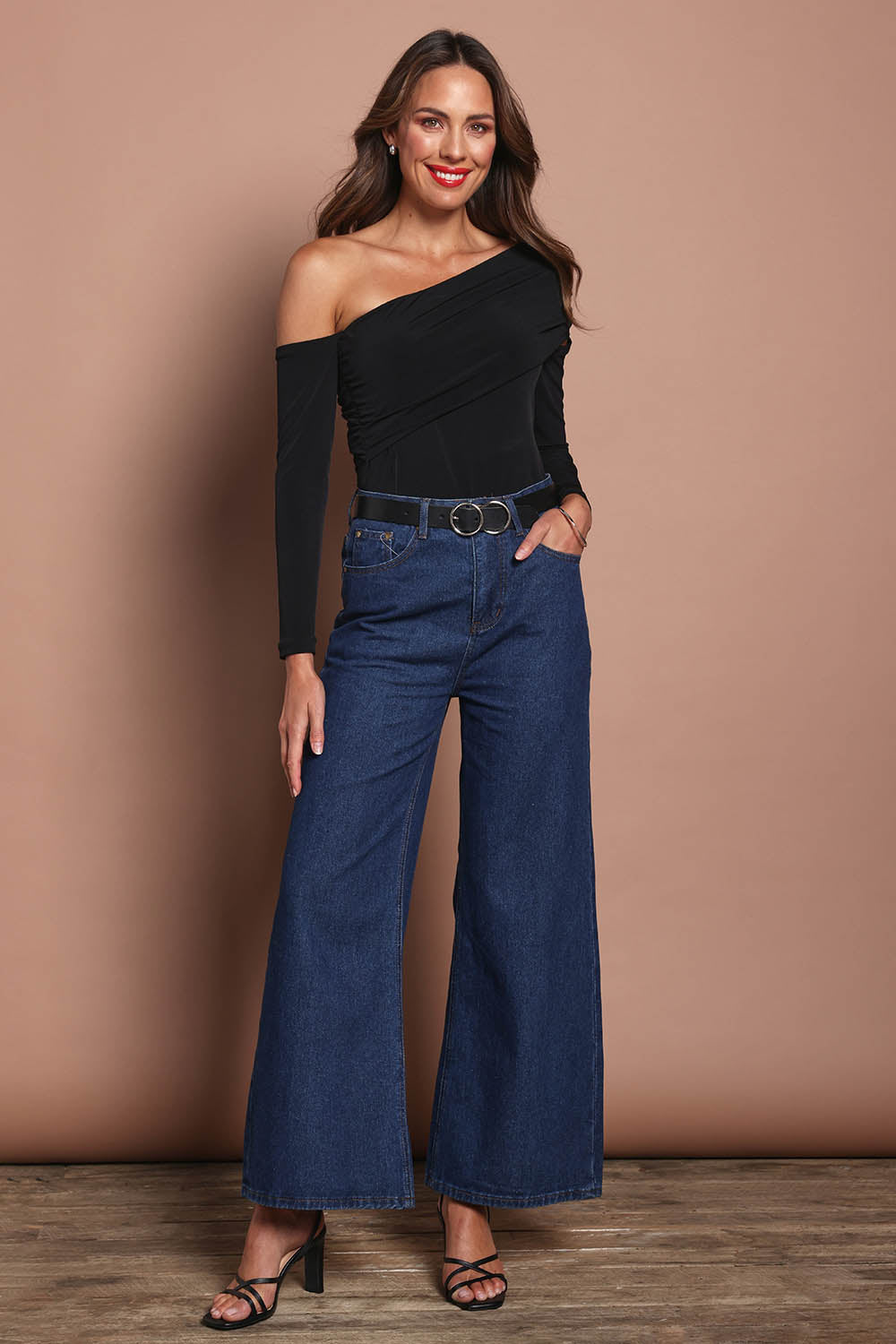 Model Madeline wearing size 10 of the Lucy Top in colour Black (Black), from the front, showing the whole outfit