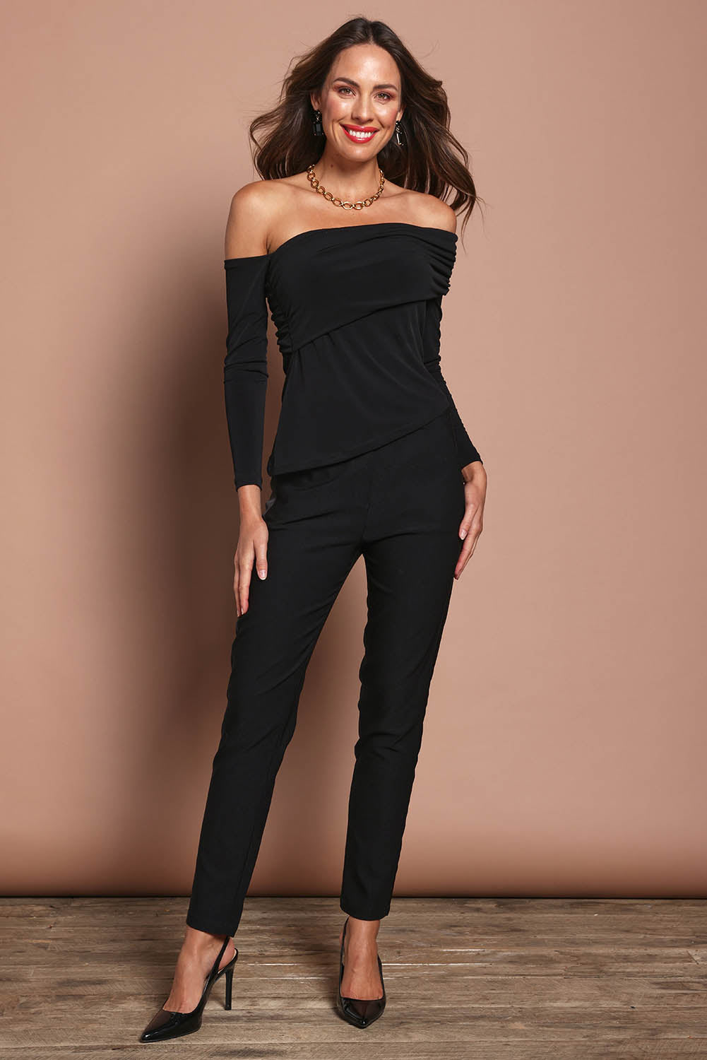 Model Madeline wearing size 10 of the Lucy Top in colour Black (Black), from the front, showing the whole outfit