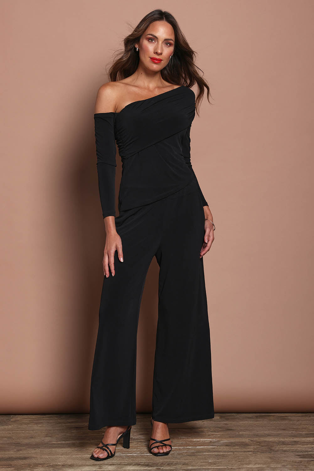 Model Madeline wearing size 10 of the Lucy Top in colour Black (Black), from the front, showing the whole outfit