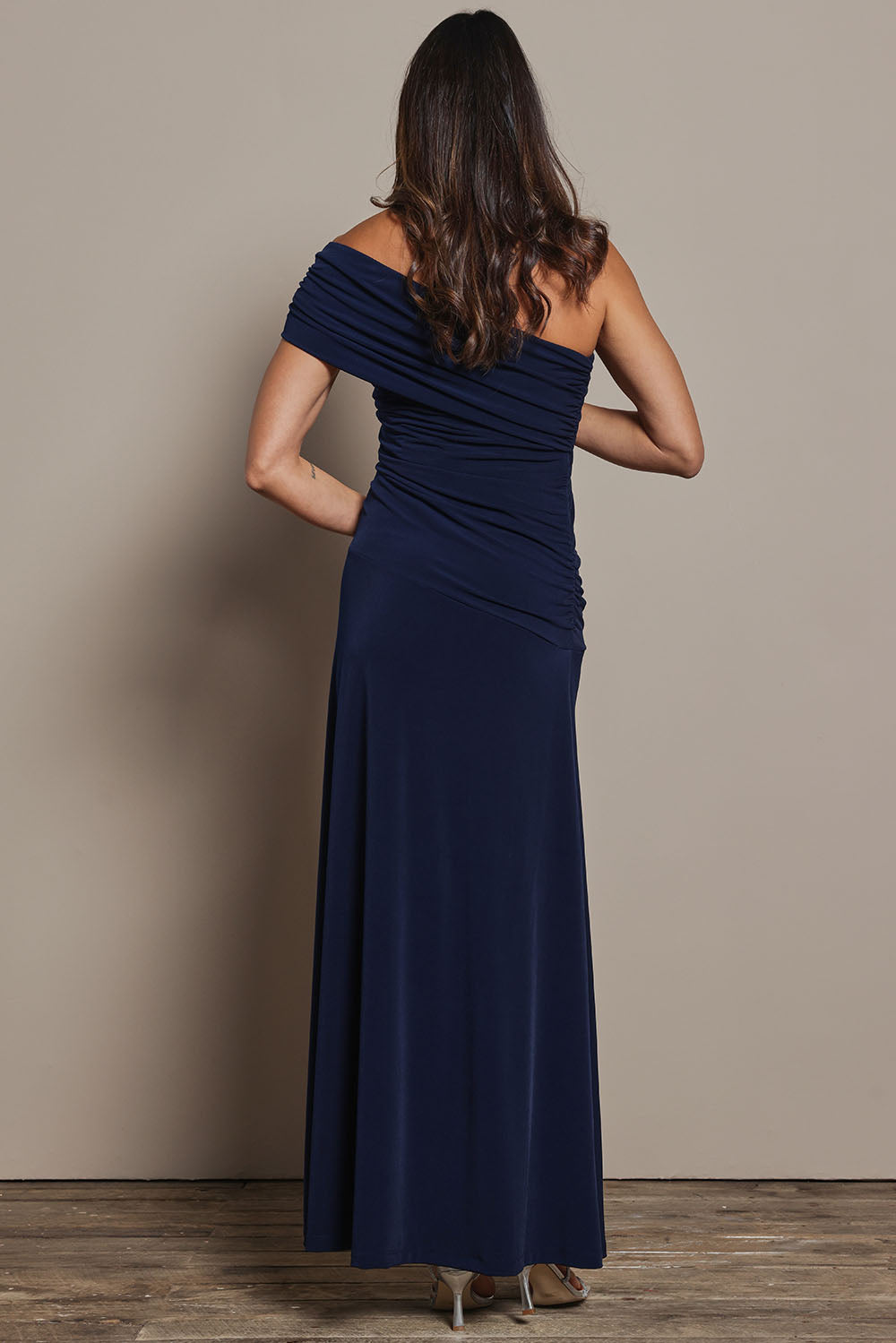Model Amanda wearing size 10 of the Lucy Dress in colour Navy (Blue), from the back