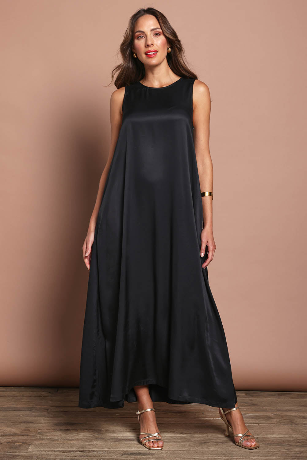 Model Madeline wearing size 10 of the Linda Dress in colour Black (Black), from the front, showing the whole outfit