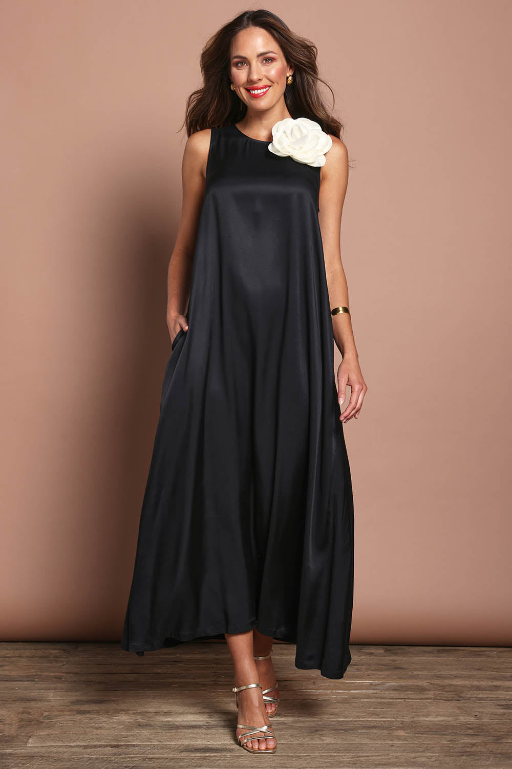 Model Madeline wearing size 10 of the Linda Dress in colour Black (Black), from the front, showing the whole outfit