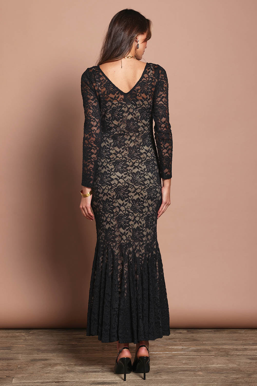 Model Madeline wearing size 10 of the Claire Lace Dress in colour Black (Black), from the back