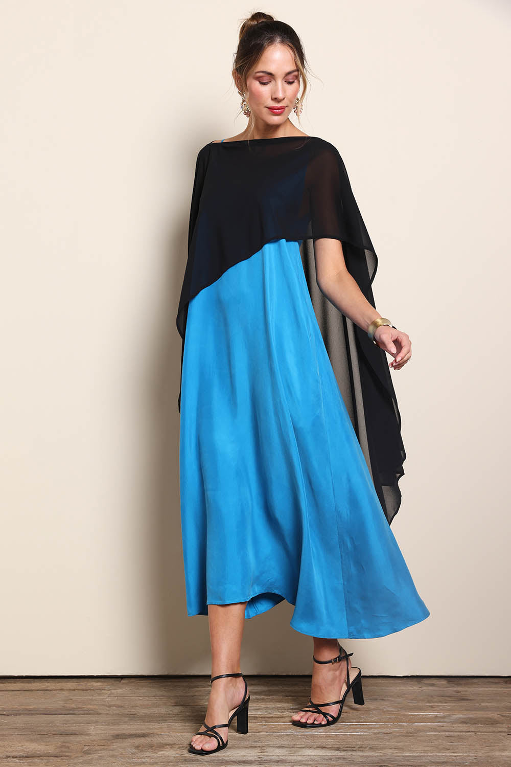 Model Maddiec wearing size 10 of the Freya Sheer Wrap – Black in colour Black, from the front