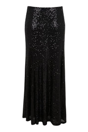 Product shot of the Remy Sequin Skirt – Black in colour Black, from the back
