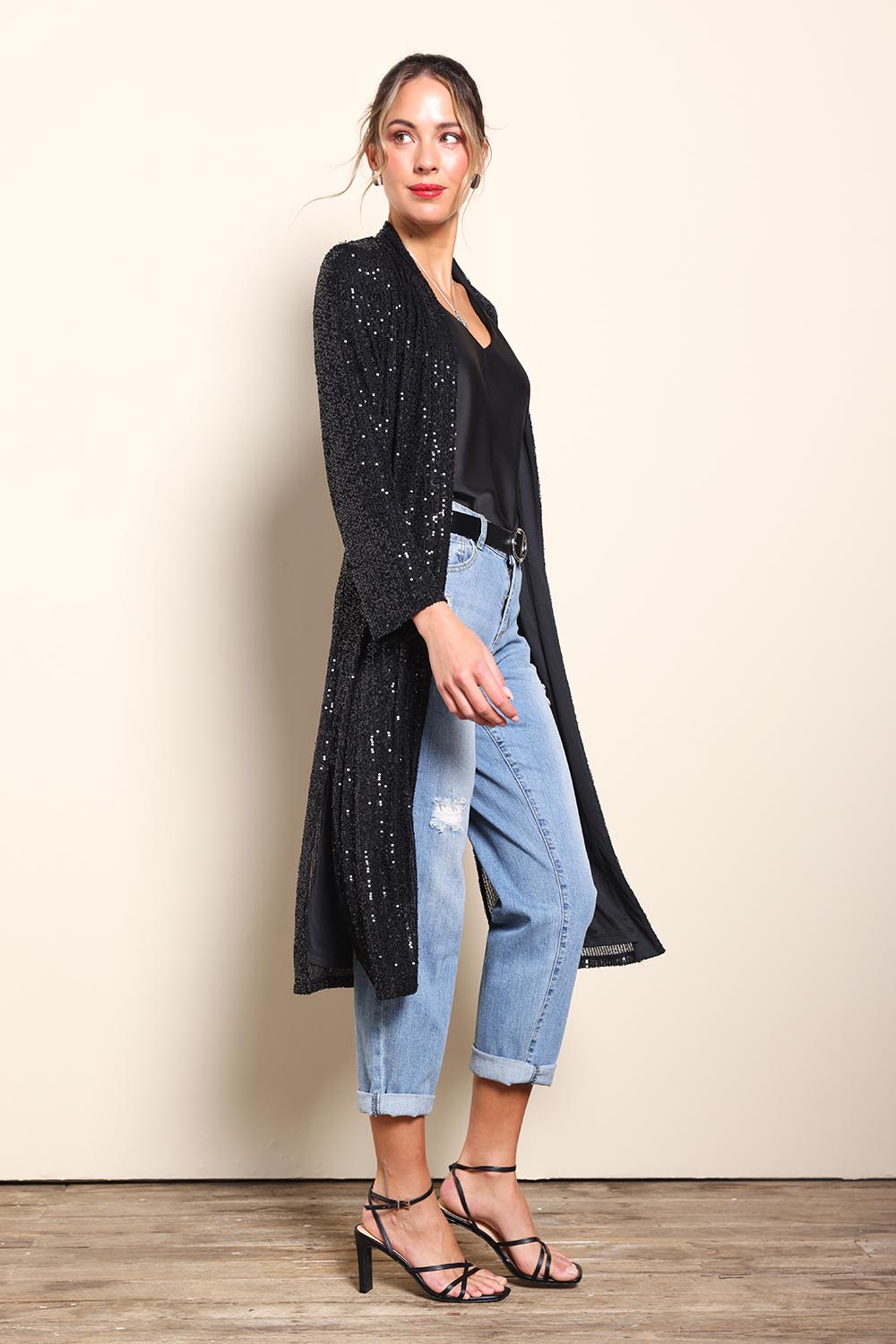 Model Maddiec wearing size 10 of the Reece Sequin Jacket – Black in colour Black, from the front