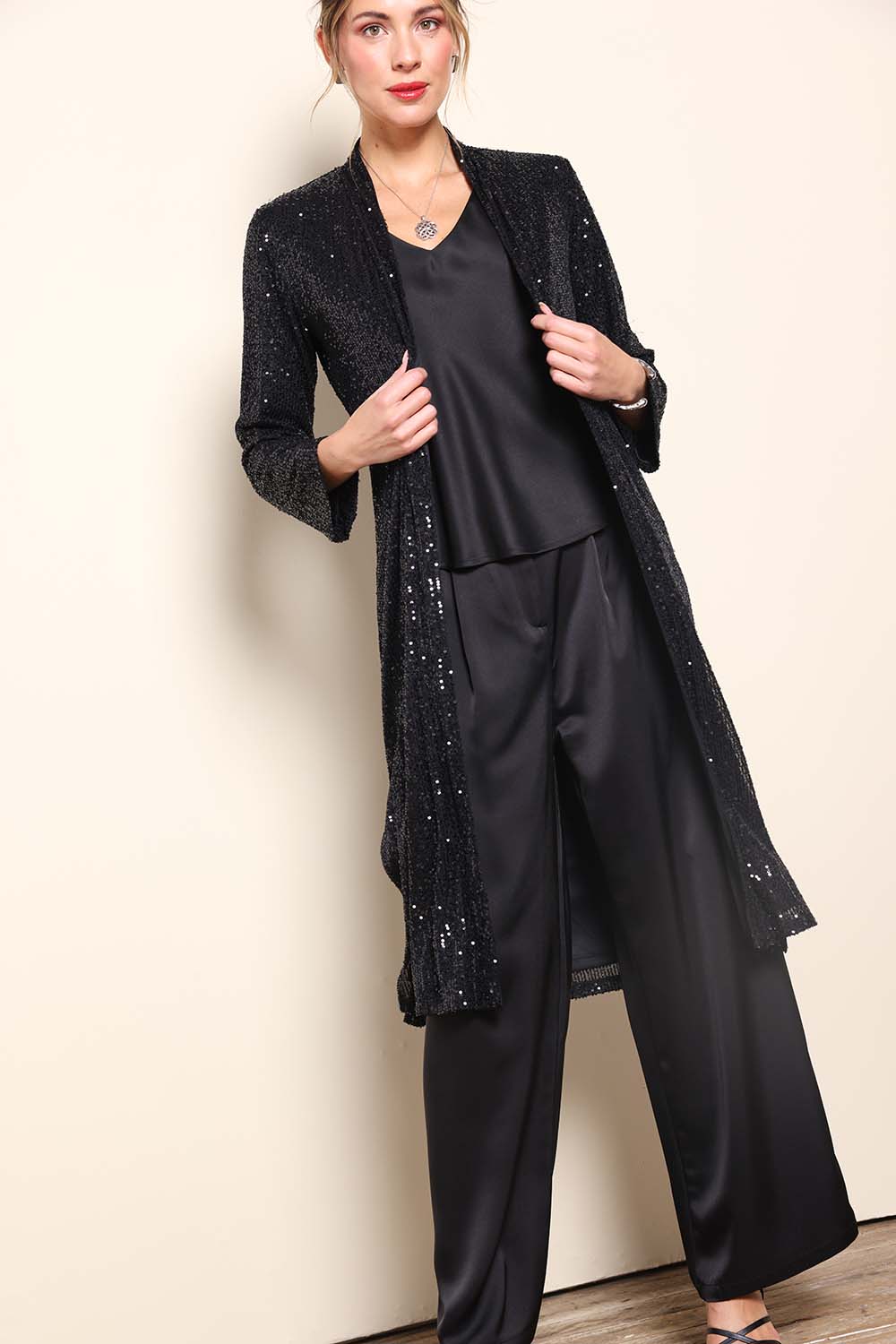 Model Maddiec wearing size 10 of the Reece Sequin Jacket – Black in colour Black, from the front
