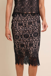 Model Amandam wearing size 10 of the Kiki Lace Skirt - Black in colour Black, in a cropped view
