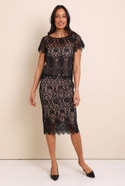 Model Amandam wearing size 10 of the Kiki Lace Skirt - Black in colour Black, from the front