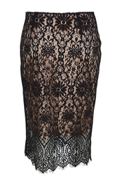 Product shot of the Kiki Lace Skirt - Black in colour Black, from the back