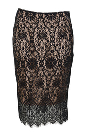 Product shot of the Kiki Lace Skirt - Black in colour Black, from the front