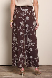 Model Maddiec wearing size 10 of the Celia Pants - Chocolategold in colour Chocolategold, from the front